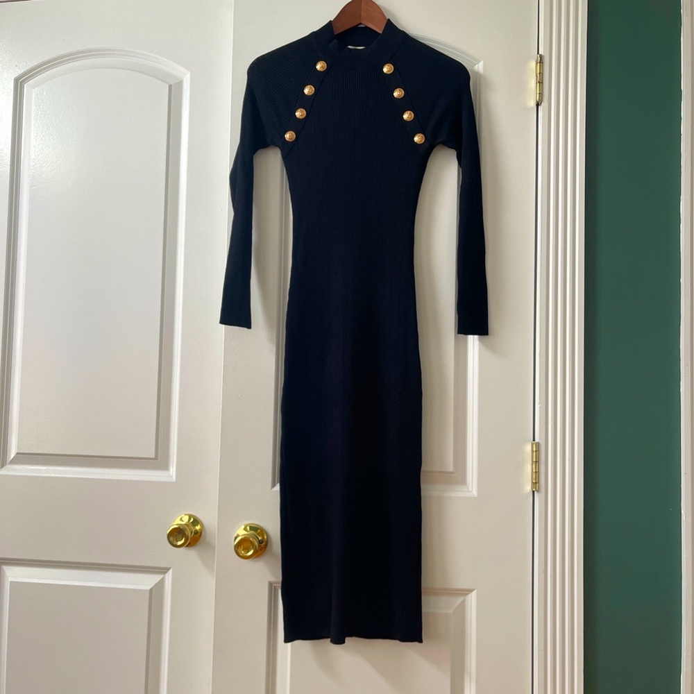 Cute long sleeve black dress with gold buttons.
